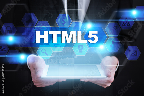 Businessman holding tablet PC with html5 concept.