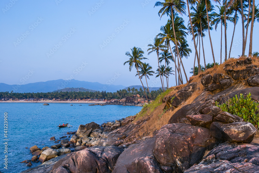 Palolem beach on sunset. Rocky coast in Goa, India Palolem beach on sunset. Rocky coast in Goa, India