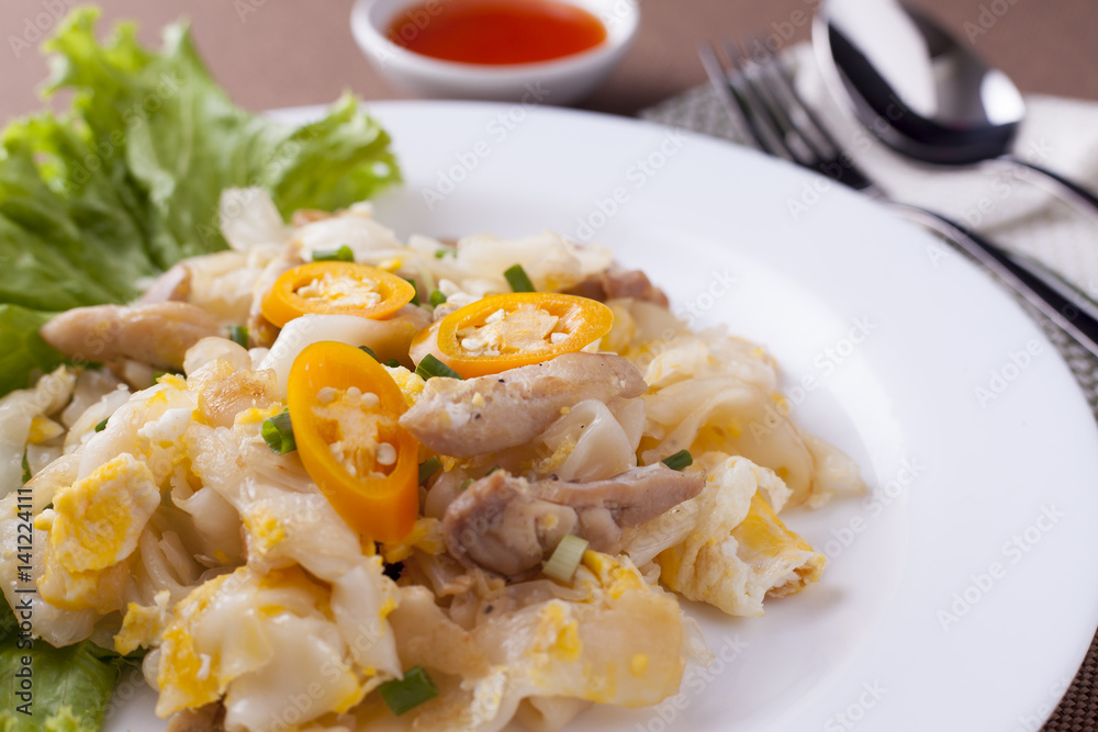 Close up fried noodle with chicken in white dish, delicious food for breakfast. Close up fried noodle with chicken in white dish, delicious food for breakfast.
