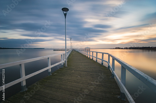 wooden pier by the sea, long exposure, evening