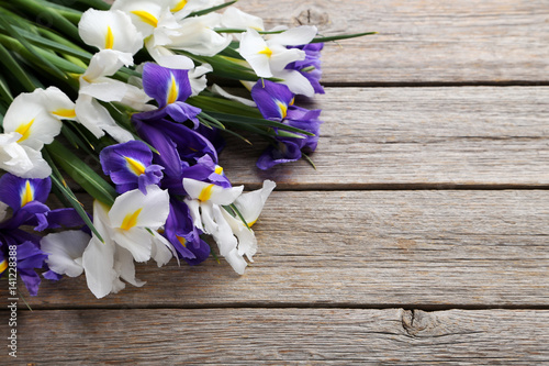Fototapeta Naklejka Na Ścianę i Meble -  Bouquet of iris flowers on grey wooden table