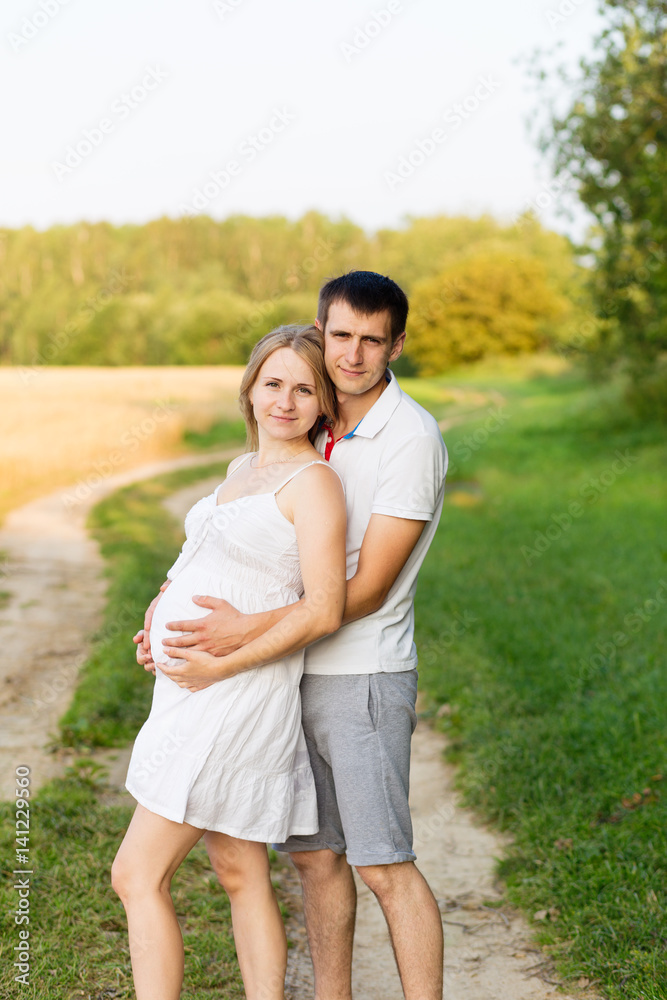 Portrait of beautiful young future parents outdoors Portrait of beautiful young future parents outdoors