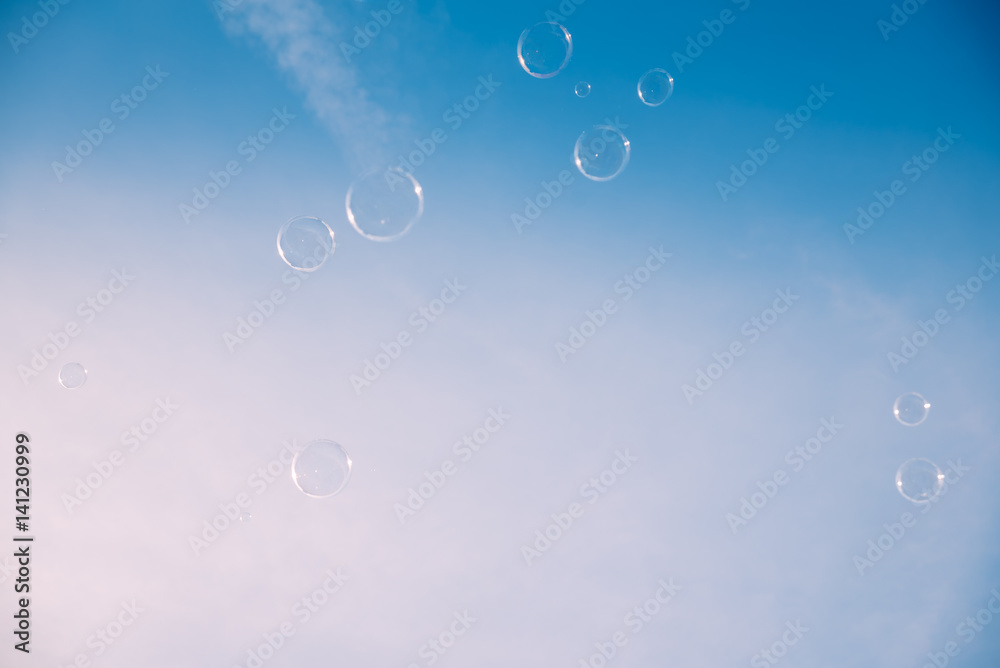 Soap bubbles against the clear blue sky Soap bubbles against the clear blue sky