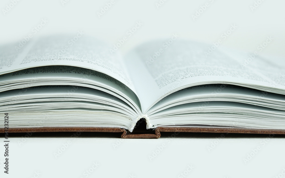 Open book, close up. Isolated on white background Open book, close up. Isolated on white background