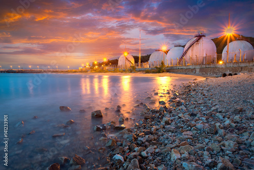 Natural Gas storage tanks , Oil tank , LPG , Petrochemical plant , Petroleum at sunset