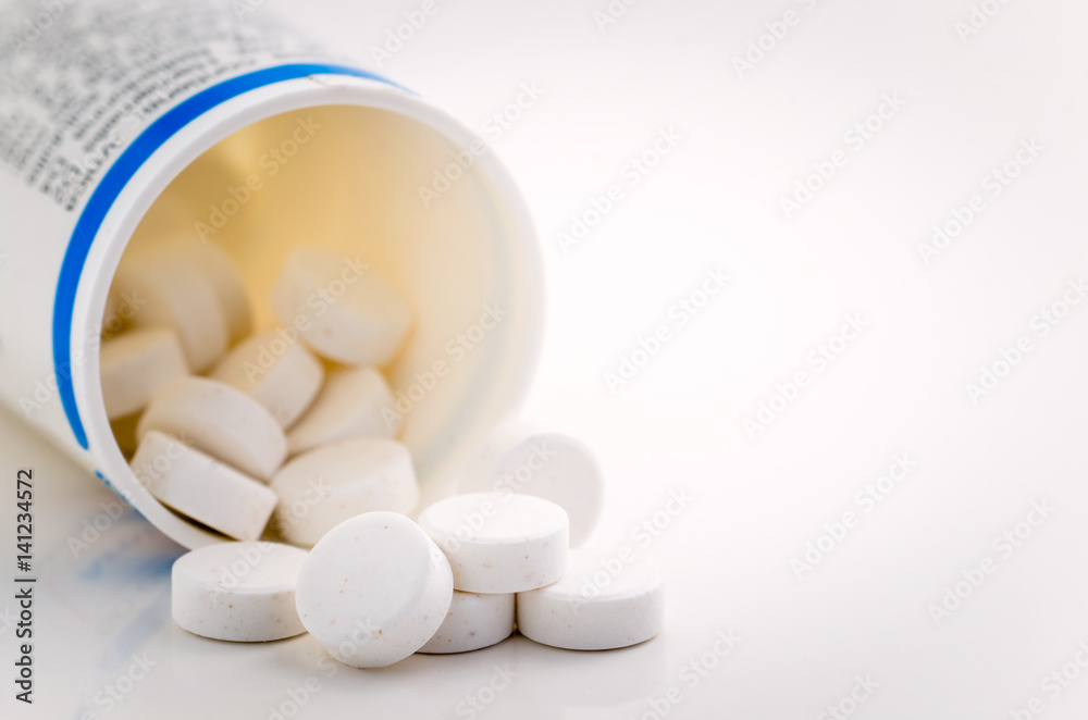 Medicine Pills Spilling from a Container