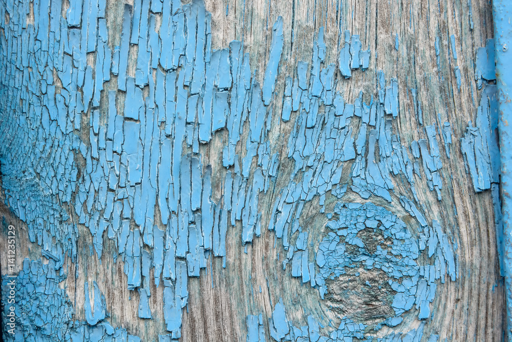 Blue cracked painting on wooden surface Blue cracked painting on wooden surface