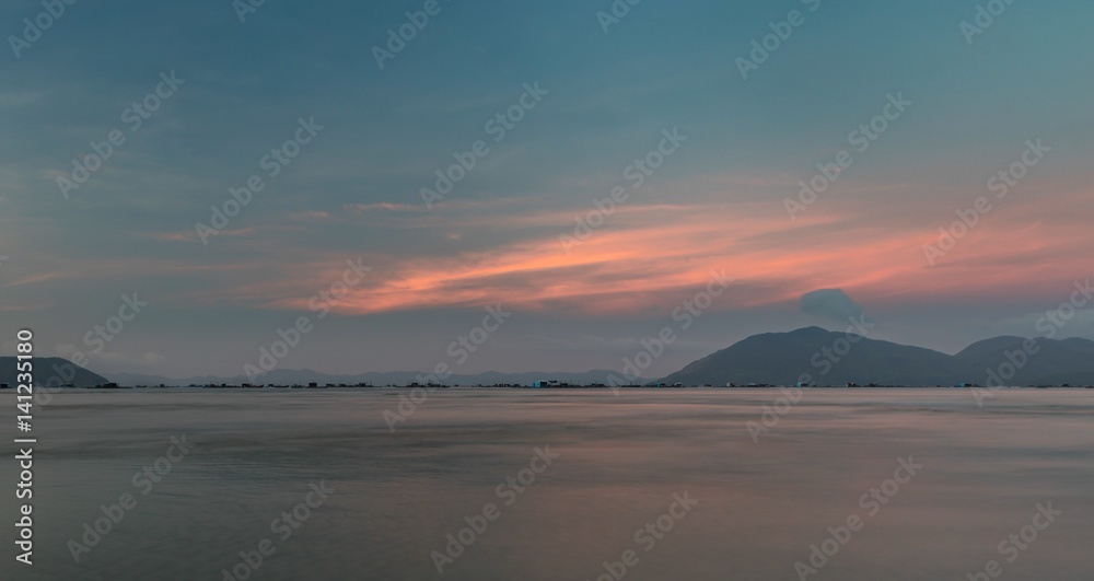 A pink evening sky looking out over the south China sea in Vung Lam Bay Vietnam.