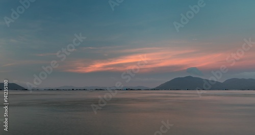 A pink evening sky looking out over the south China sea in Vung Lam Bay Vietnam. © Paul Hampton
