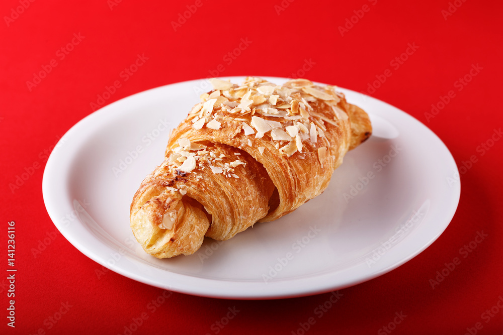 breakfast croissant on a red background