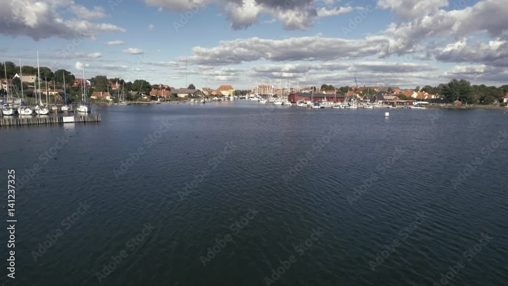 Aerial Of Sailboats Part 5. Flying low over the water And Raises High Up Over Port And City In 4K Aerial Of Sailboats Part 5. Flying low over the water And Raises High Up Over Port And City In 4K