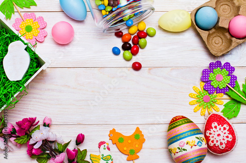 Colorful Easter decoration on wooden background. Happy Easter.