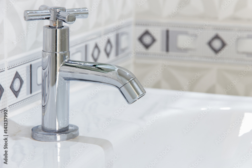 Modern design home bathroom faucet on sink White colur sanitary ware in the bathroom Modern design home bathroom faucet on sink White colur sanitary ware in the bathroom