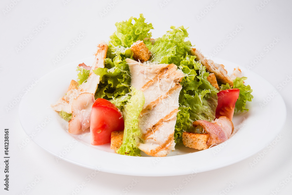 salad with bacon, tomatoes and croutons on a white plate (close) salad with bacon, tomatoes and croutons on a white plate (close)