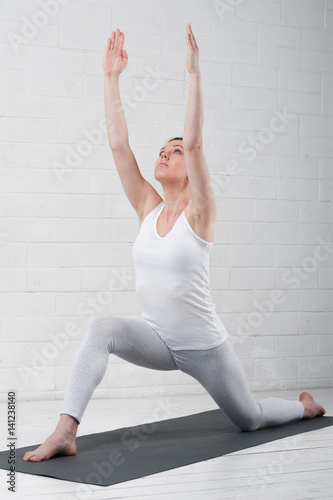 Fototapeta Naklejka Na Ścianę i Meble -  Young attractive woman practicing yoga