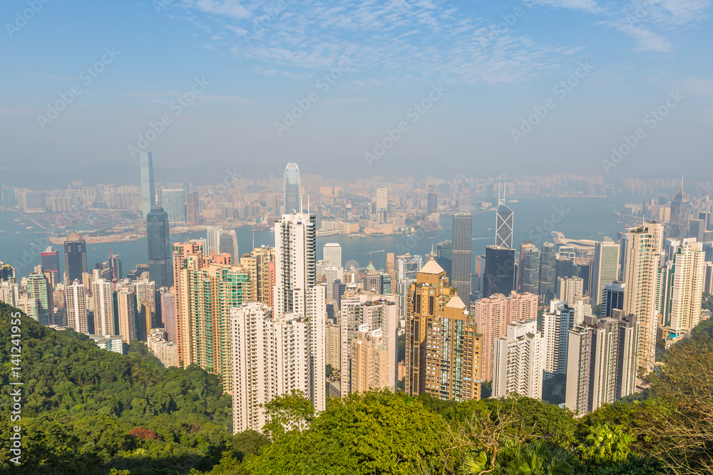 Fototapeta premium Aerial view of Victoria Harbour skyline from Sky Terrace 428, the viewing platform on top of the Peak Tower, icon building in Hong Kong.