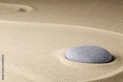Meditation stone in a Japanese zen garden, background concept for purity harmony balance simplicity and relaxation...
