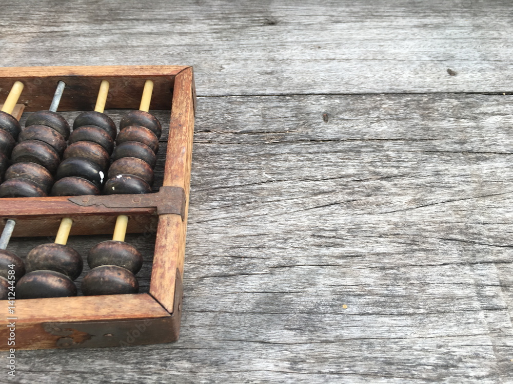abacus , ancient calculator on wooden background with copy space for text-Business and financial concept abacus , ancient calculator on wooden background with copy space for text-Business and financial concept