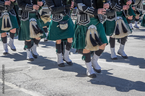 Closeup of green kilts of bagpipes players at 2017 St. Patrick's Day Parade in New York City