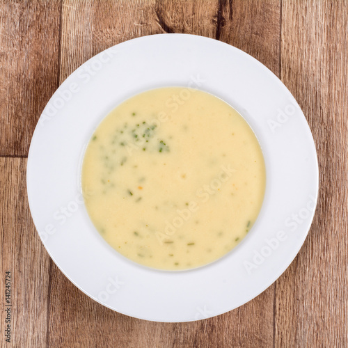 Vegetable soup on a wooden table