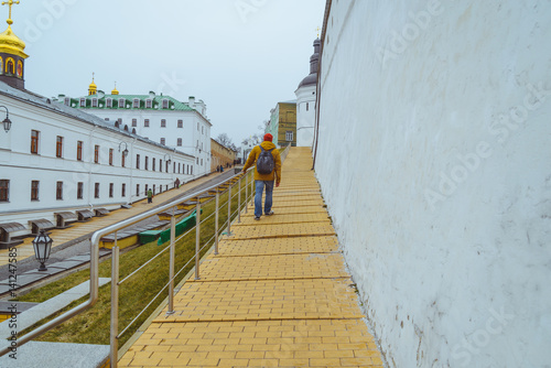 people walk in pecherska lavra