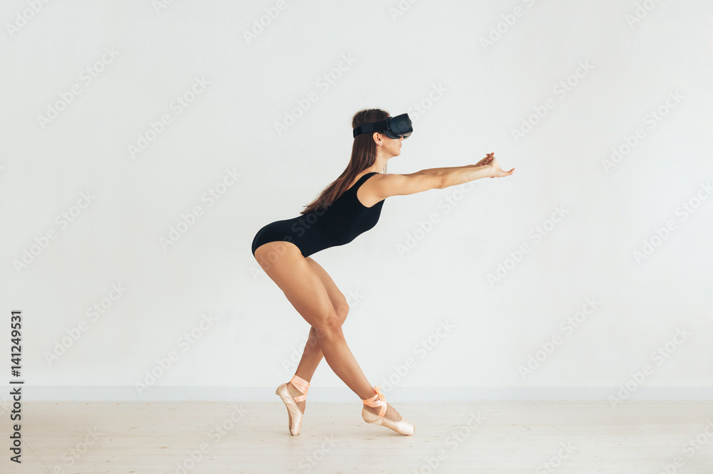 Sport athlete girl with a beautiful figure dancing with glasses of