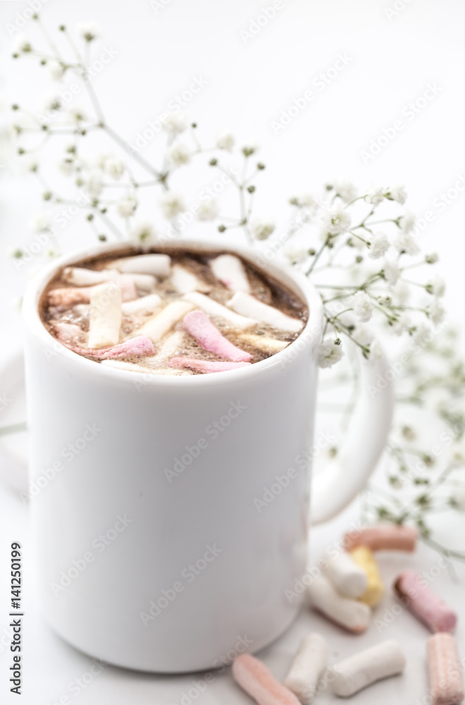 white coffee Cup with marshmallows and flowers