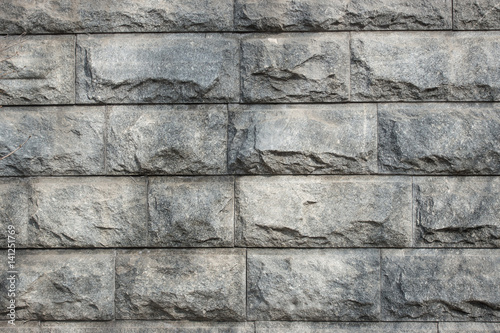 Texture of a gray stone wall.