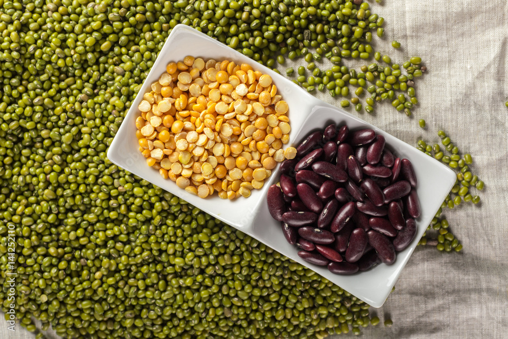 Fototapeta premium mix of beans on wooden table