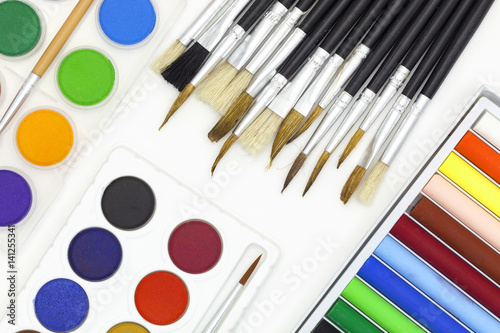 Paint brushes and Paints isolated on white background.
