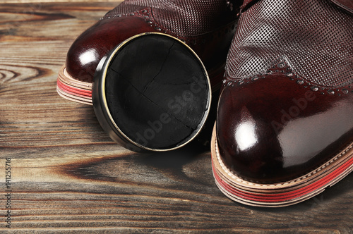 leather shoes on table with polishing equipment. Fashion handmade. Wax