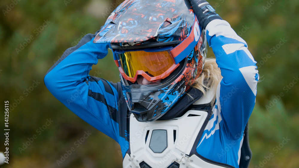 MX moto Girl in a helmet - cross racing Photos | Adobe Stock