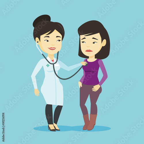Doctor listening to chest of patient.