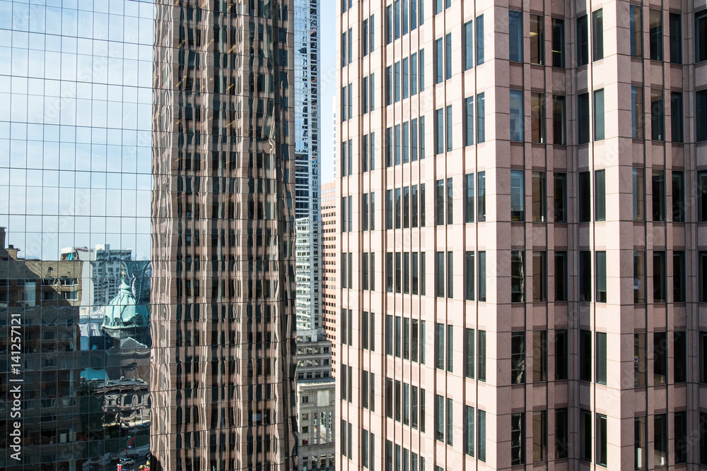 Street view with skyscrapers reflected in glass in the City Center of Philadelphia, Pennsylvania, USA. Street view with skyscrapers reflected in glass in the City Center of Philadelphia, Pennsylvania, USA.