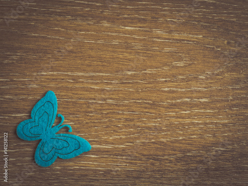 Butterfly decoration on a wooden background.