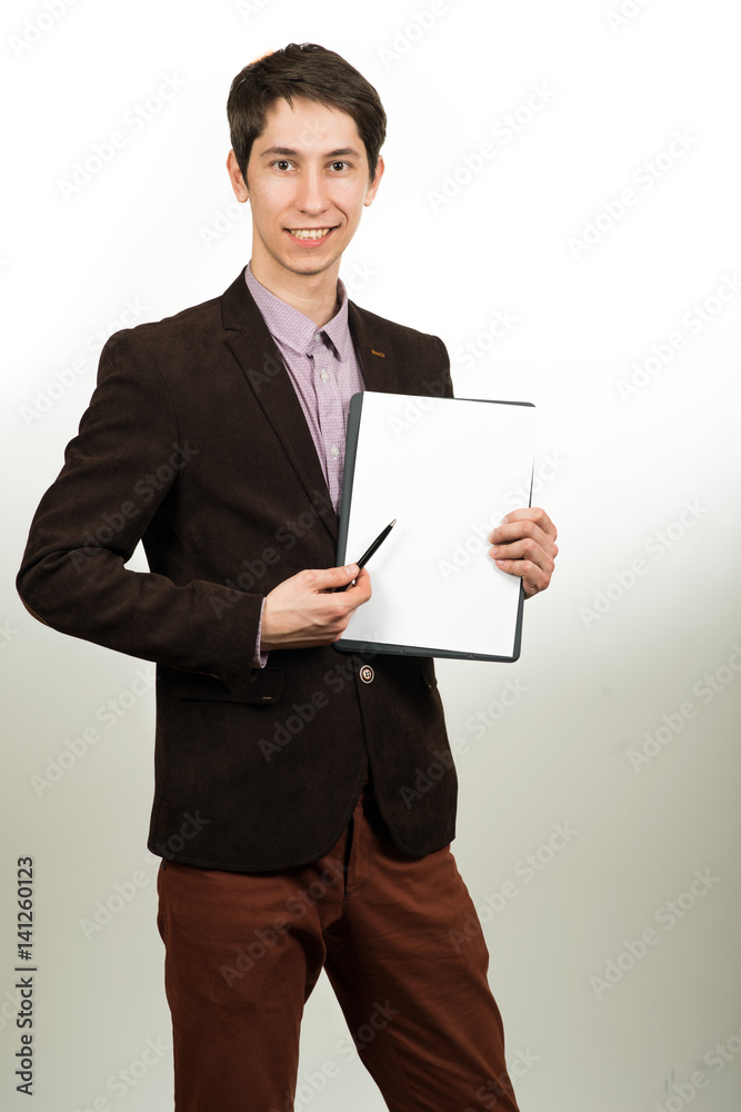 Smart businessman holding a sheet of paper and pen Smart businessman holding a sheet of paper and pen