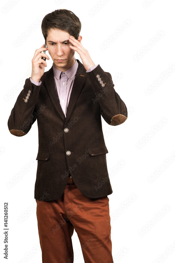 Portrait of a young pensive businessman talking on cell phone Portrait of a young pensive businessman talking on cell phone