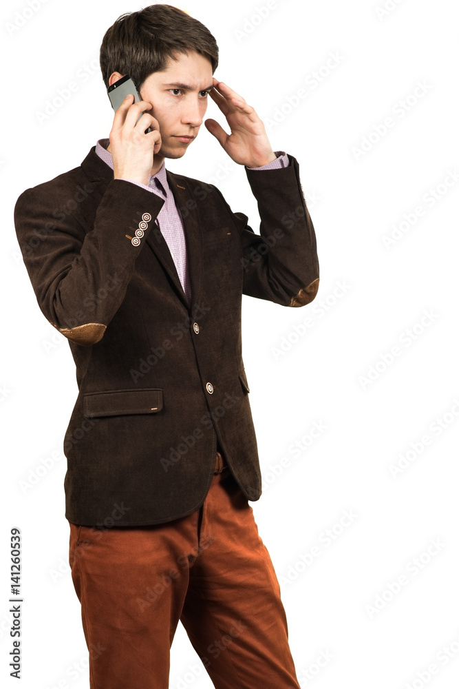 Portrait of a young pensive businessman talking on cell phone Portrait of a young pensive businessman talking on cell phone