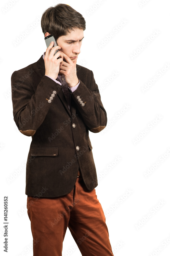 Portrait of a young pensive businessman talking on cell phone Portrait of a young pensive businessman talking on cell phone
