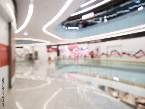 Interior of the modern building, blurred shopping mall background. Commercial or business center.