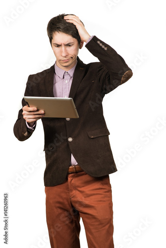 Portrait of handsome man thinking and looking business with a tablet in hand isolated