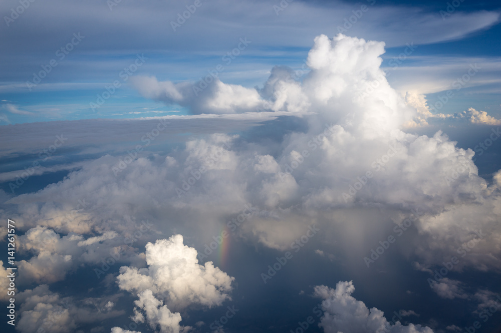 View from airplane the blue sky and rainbow while raining View from airplane the blue sky and rainbow while raining