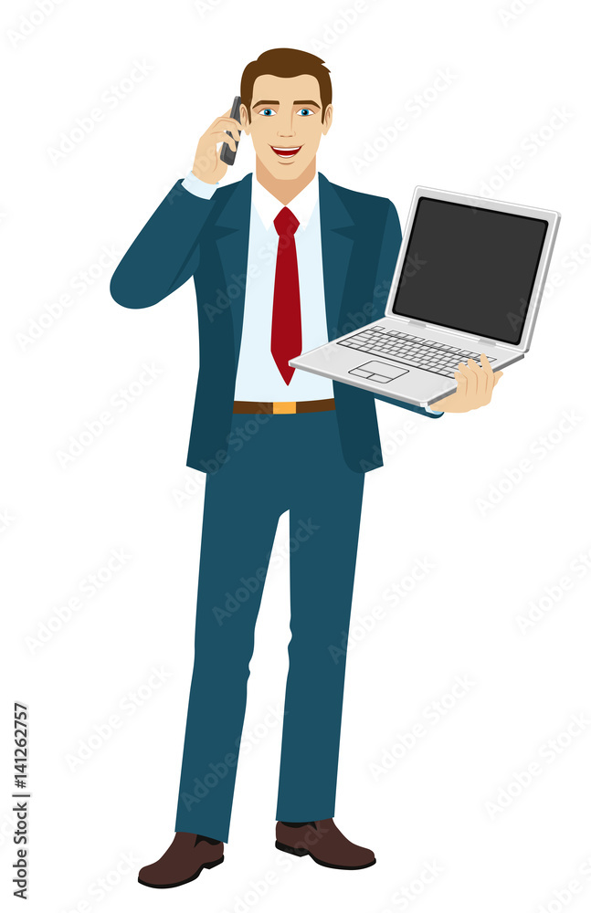 Businessman holding laptop notebook and talking on the mobile phone Businessman holding laptop notebook and talking on the mobile phone