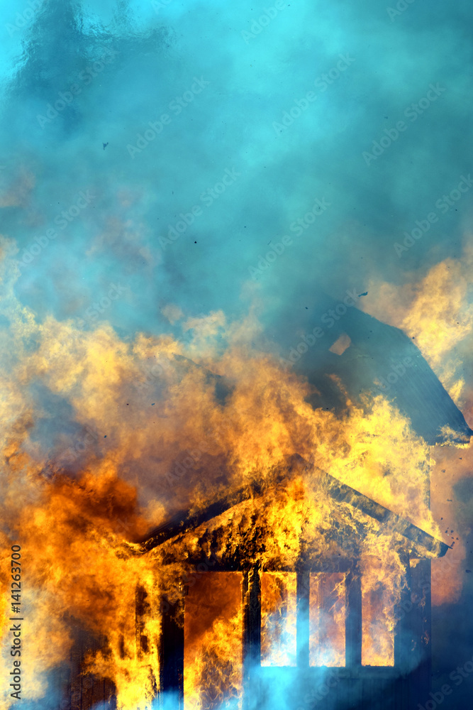 Close up of burning house. Vertical image.