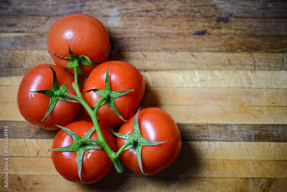 Tomatoes on wood board Tomatoes on wood board