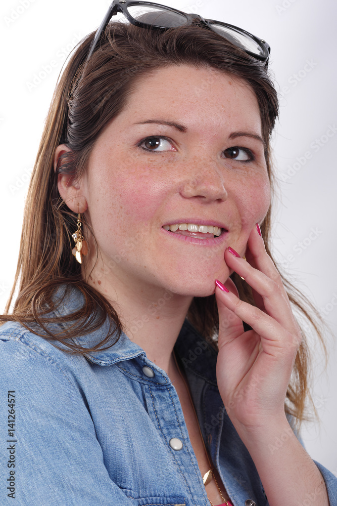 Young woman in jeans jacket with glasses Young woman in jeans jacket with glasses