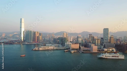 AERIAL. Top view of Hong Kong city and huge cruise laner with Malaysia flag. photo