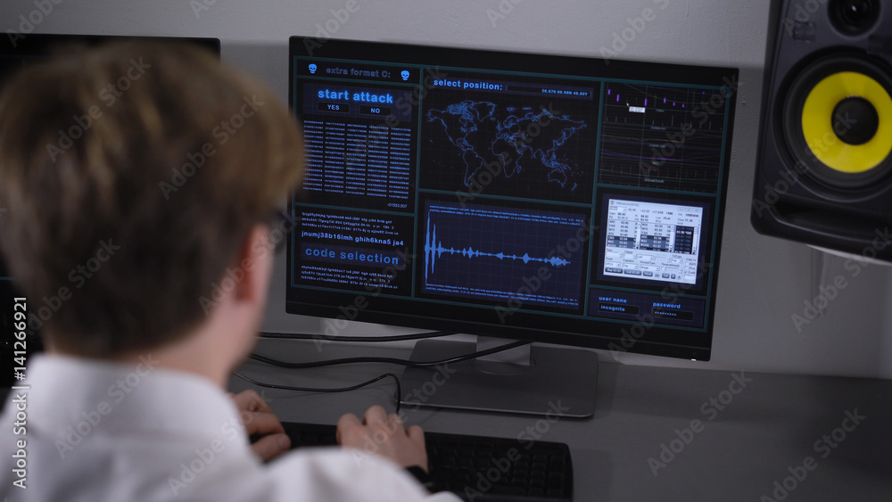 Computer room. The programmer by means of certain programs understands computer errors. The young man in a white shirt enters special codes and data into the computer. Computer room. The programmer by means of certain programs understands computer errors. The young man in a white shirt enters special codes and data into the computer.