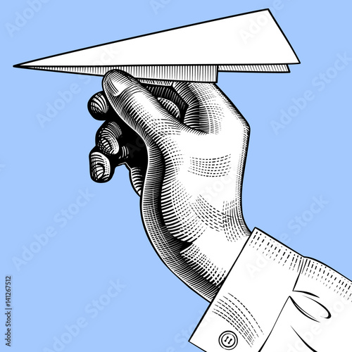 Hand with a paper plane.