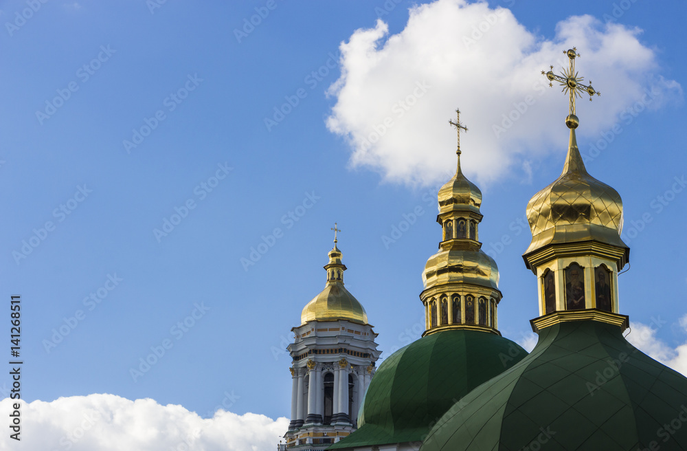 Domes of Kiev Pechersk Lavra against the background of a cloudy sky